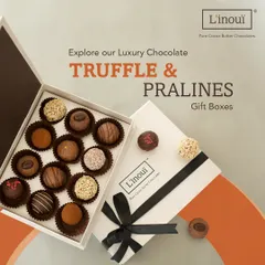 Our luxury truffle and praline gift box, opened to reveal an assortment of handcrafted chocolates. This is our most popular gift, perfect for celebrating anniversaries, promotions, or simply showing appreciation with a truly decadent treat.