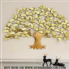 This unique wall art piece depicts a tree with butterfly-shaped leaves, all handcrafted from metal with a beautiful antique golden finish. It includes backlighting to create a magical, glowing effect, symbolizing growth and transformation.