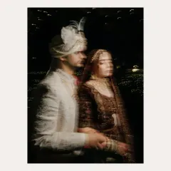 An artistic, motion-blur portrait of the couple at night. This creative shot captures a fleeting, dreamlike moment of their wedding day.