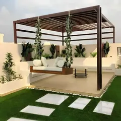 We designed this rooftop terrace to be a peaceful escape from the city. The custom-built pergola provides shade for a comfortable hanging swing sofa, surrounded by built-in planters and artificial turf. It’s a perfect example of how we create low-maintenance, high-impact outdoor living areas.