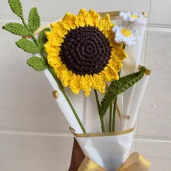 Brighten up any room with our handmade crochet sunflower and daisy bouquet. These "forever flowers" are crafted with vibrant yellow and white yarn, complete with detailed green leaves, and wrapped beautifully for the perfect, lasting gift.