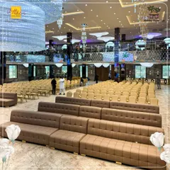 The flexible seating arrangement in our Karjat hall can be configured to suit any event size. Here, you can see the combination of comfortable, multi-tiered lounge sofas and rows of elegant chairs, ensuring every guest has a great view of the stage.