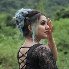 This angle highlights the intricate lace-up back of the dress and the elegant hair updo, showing that our training covers the full look.