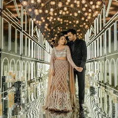 For Pranavi and Labhya's cocktail night, we created an atmosphere of pure glamour. Her shimmering lehenga and his sleek, modern suit were styled to complement each other perfectly, creating a powerful look for a night of celebration under a tunnel of lights.