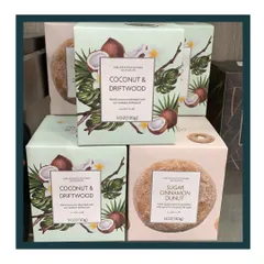 I source candles with unique and soothing scents you've never smelled before. Pictured here are the beautifully packaged Coconut & Driftwood and Sugar Cinnamon Donut candles.