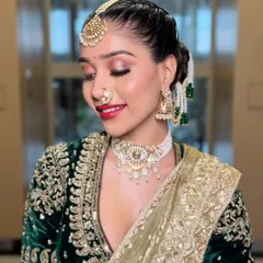 A beautiful, smiling portrait of the bride. This shot captures the joy and elegance of the Maharashtrian look, with the shimmering eyeshadow and radiant skin catching the light perfectly.