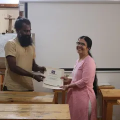 Another proud moment as a dedicated student receives her course completion certificate. Her smile reflects the hard work and passion she put into her art.