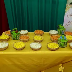 It's all in the details. For this Haldi, we arranged bowls of fresh flower petals for guests to shower the couple with blessings. This small touch adds an interactive and traditional element to the ceremony.