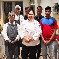 Meet Chef Pooja Sachdev and our talented kitchen team. This group photo captures the happy and dedicated individuals who work tirelessly to create every gourmet dish with love.