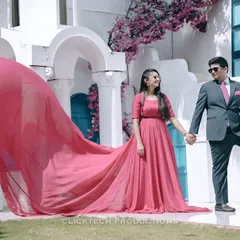 A dramatic, high-fashion pre-wedding shot featuring a flowing pink gown. I can help style and execute these "music video" type concepts to make your shoot unique.