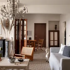 Another view of this eclectic living room, showing how we layered different styles and materials. The space is designed to feel warm, inviting, and full of character, not bound by any single trend.