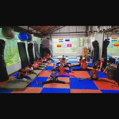 A look inside one of our kids' gymnastics classes. Here, the students are working together on their middle splits, a key component of building flexibility.
