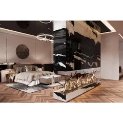 This master bedroom is designed as a luxurious retreat. We incorporated a statement fireplace with a dramatic black and gold marble finish, creating a stunning focal point. The design balances bold textures with soft, comfortable furnishings for a truly unique personal sanctuary.