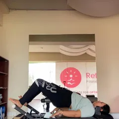 The focus here is on the articulation of the spine as the client lowers down from a bridge. We practice this slow, controlled movement to increase spinal mobility and awareness.