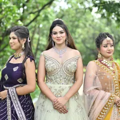 A beautiful group shot showcasing the variety in our reception wear. Featuring a pastel off-shoulder gown, a purple lehenga, and a mustard yellow lehenga, we have options for every taste.