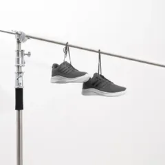 Sometimes the simplest setup is the most effective. Here, we're using a basic studio stand to hang a pair of sneakers for a clean, floating effect against a white background, perfect for e-commerce listings.