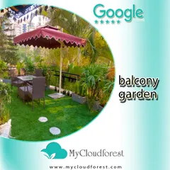 This balcony is designed to be a comfortable and functional outdoor cafe. A large umbrella provides shade over a dining set, all placed on a lush artificial lawn. It’s a practical and inviting setup that makes the most of the balcony space for dining or relaxing.