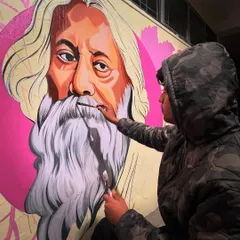 A close-up shot of me adding the final touches to the beard of Rabindranath Tagore. This shows the level of detail and brushwork that goes into creating these large-scale realistic portraits.