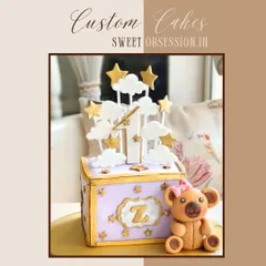 A whimsical custom cake for a first birthday. I designed this to look like a toy box, with a sweet teddy bear, clouds, and stars to celebrate the special milestone.