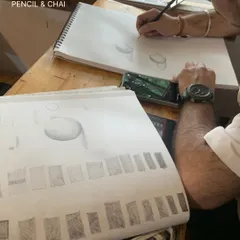 A student's practice sheet showing exercises in shading and form. This disciplined practice is the key to understanding how to render three-dimensional objects.