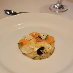 A classic Salmon Tartare, finely diced and seasoned, served with pickled vegetables and a surprising scoop of Dijon mustard ice cream.