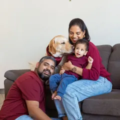 And then there were four. This is the kind of relaxed, love-filled family portrait I live to create, right in the comfort of your own home where everyone, including your furry friend, feels at ease.