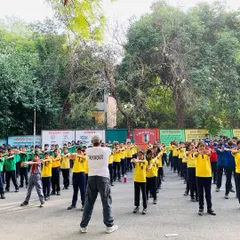 Leading a large group of students at a school workshop is where my passion comes to life. You can see the focus and discipline as they all practice a blocking technique in unison, turning a schoolyard into a training ground for confidence.