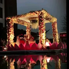Imagine taking your vows on a mandap that floats on water. I specialize in bringing unique concepts like this floating lotus mandap to life, creating a truly magical and romantic setting for your wedding ceremony.