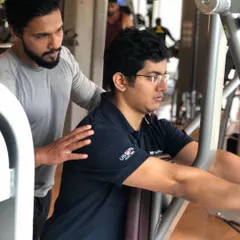 Form is everything. Here, I am providing hands-on guidance to a client during a chest press exercise. I ensure every repetition is performed with perfect technique to maximize results and prevent injury, whether you are a beginner or an experienced lifter.