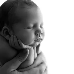 A perfect, peaceful close-up. I focus on capturing the delicate features of your newborn, from their tiny lips to their soft cheeks, in these classic fine art portraits.