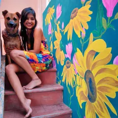 A splash of sunshine for a home staircase. This vibrant sunflower mural was designed to bring joy and energy into the space. It’s a perfect example of how I use bright, happy colors to completely transform a part of your home. And yes, that’s my furry assistant approving of the final work.