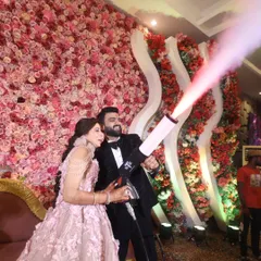 A fun and high-energy moment from an engagement party. The couple uses a CO2 smoke gun, adding a touch of modern fun and excitement to their celebration, and I was right there to capture their joyful expressions.