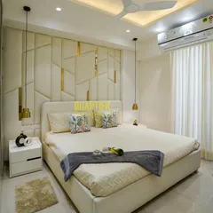 I believe a master bedroom should be a personal retreat. For this home in Tata LaVida, Gurugram, I designed a custom upholstered headboard with geometric patterns and gold inlays, complemented by soft pendant lighting to create a serene and luxurious atmosphere for rest and relaxation.