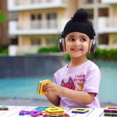 A happy, smiling portrait that perfectly showcases the t-shirt's design. This is a great commercial shot for a children's apparel brand.