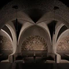 A symmetrical composition of the dining pods. The raw stone backdrops contrast with the smooth, sculpted concrete, creating a rich tactility and a visual anchor for each seating area.