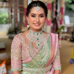 A vision in pastels. Manasa’s look is a testament to modern elegance, where soft, ethereal makeup complements her magnificent diamond jewelry and pastel Kanjivaram saree, creating a look that is fresh, radiant, and unforgettable.
