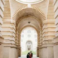 Framed by the magnificent arches of Great Britain, Akhil and Merlin share an intimate moment. I use architectural symmetry and scale to create dramatic, romantic portraits during destination photoshoots.