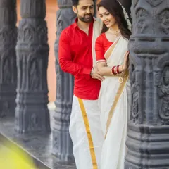A romantic couple shot at the Rameshwar Mandir set. The classic red and white combination is a timeless choice for a traditional pre-wedding theme.