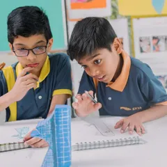 We believe in learning by doing. Here, students are deeply engaged in a hands-on project, showcasing the collaboration, focus, and excitement that are part of the daily experience at our school.