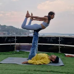 An Acro Yoga session on a yacht. This was a one-of-a-kind experience, finding balance and trust with the water all around us.