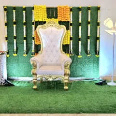 The same traditional backdrop, now complete with an ornate white and gold throne for a naming ceremony or baby shower.