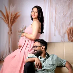 A relaxed and stylish portrait from a maternity session, using a boho-themed setup in our studio.