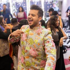 A candid moment of me enjoying the music and dancing with guests at a wedding sangeet. My job is to make sure everyone feels the energy and joins the celebration.