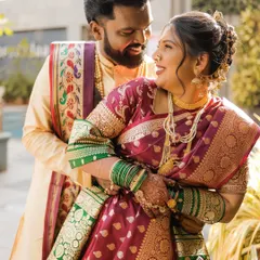 A beautiful moment between this Maharashtrian couple. The bride's soft and natural airbrush makeup glows in the sunlight, highlighting her happiness.