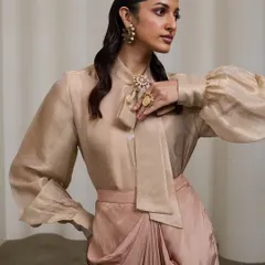 A three-quarter view that showcases the accessories and the elegant silhouette of the garment. The pose is dynamic yet poised, fitting for a royal-inspired look.