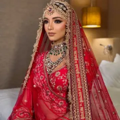 This look is all about royal elegance. Featuring a stunning red lehenga with a unique double-dupatta style and intricate matha patti jewellery, it’s a complete rental package for the bride who wants to make a grand statement.