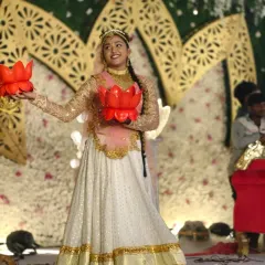 Our dancer smiles as she performs a traditional welcome dance with diya props. We ensure our performances are not just technically correct but also full of joy and expression.