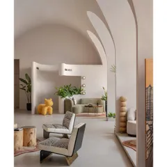 We designed this sales office in Mumbai as a harmonious blend of modern minimalism and organic warmth. The space is defined by its sculptural, vaulted ceilings and flowing walls, creating a tranquil yet sophisticated environment for business. We used a neutral palette and natural materials to craft a space that is both functional and sensory.