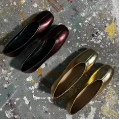 A behind-the-scenes shot of some new minimalist flats in development. I'm always exploring new colors and finishes, like this metallic burgundy and gold, while staying true to clean lines and quality craftsmanship.