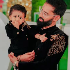 Like father, like son, pure royalty. 👑 I designed this matching father-son set featuring black velvet bandhgalas with custom gold tiger embroidery on the shoulder. It's a power move for any big event.